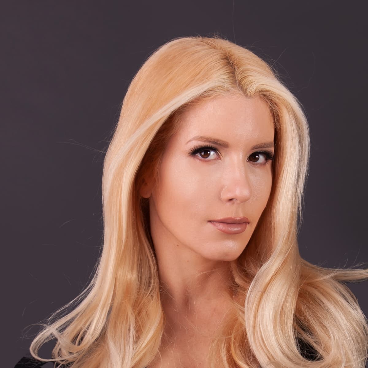 Ivana Budišin, photographed against a dark grey background.